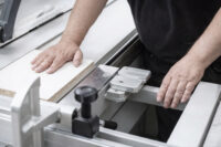 An R&J Machinery engineer providing a hands-on demo of an Altendorf panel saw.