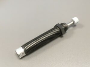 Photo of a Dashpot (Small shock Absorber) spare part