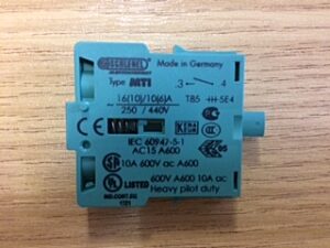 Photo of a MTI green Module push-button contact transmitter 1-S spare part