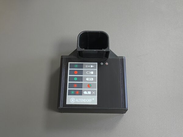 Photo of a Housing with charging cradle for exchangeable battery spare part