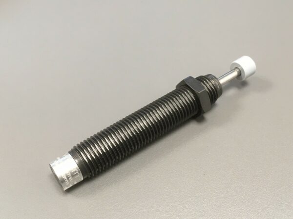 Photo of a Dashpot (Small shock Absorber) spare part