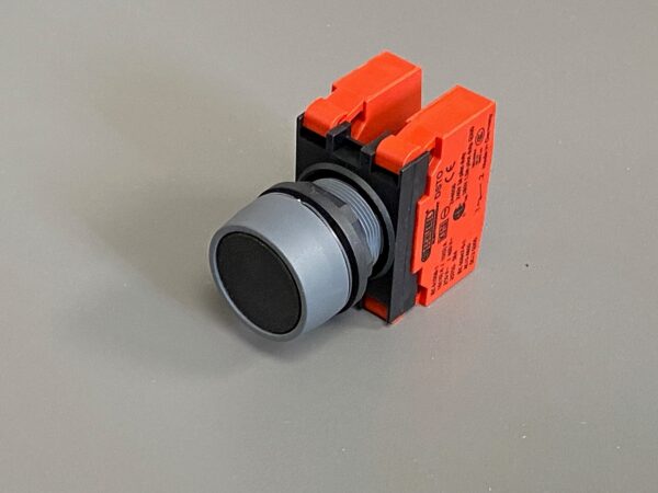 Photo of a STOP button X-axis spare part