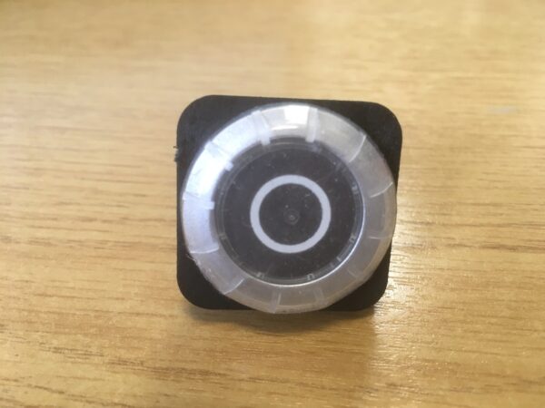 Photo of a Main saw/scorer OFF pushbutton spare part