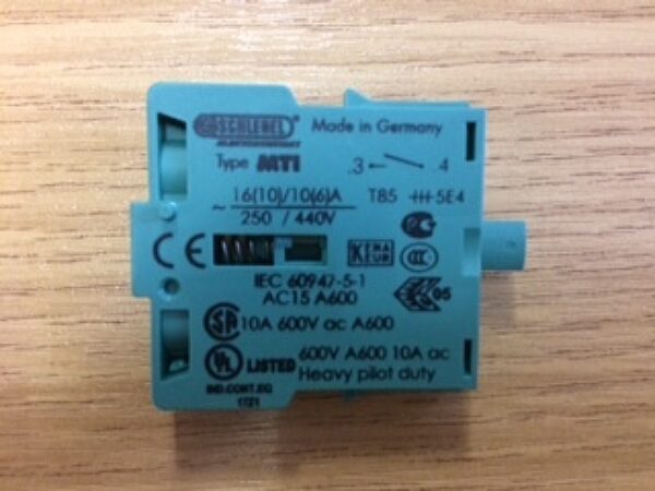 Photo of a MTI green Module push-button contact transmitter 1-S spare part